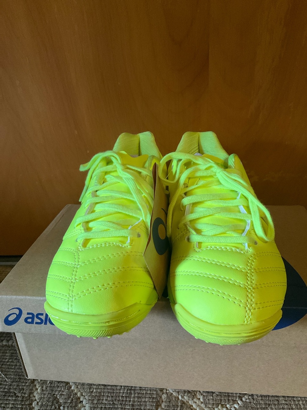 ASICS Kids’ Neon Yellow cleats - never worn